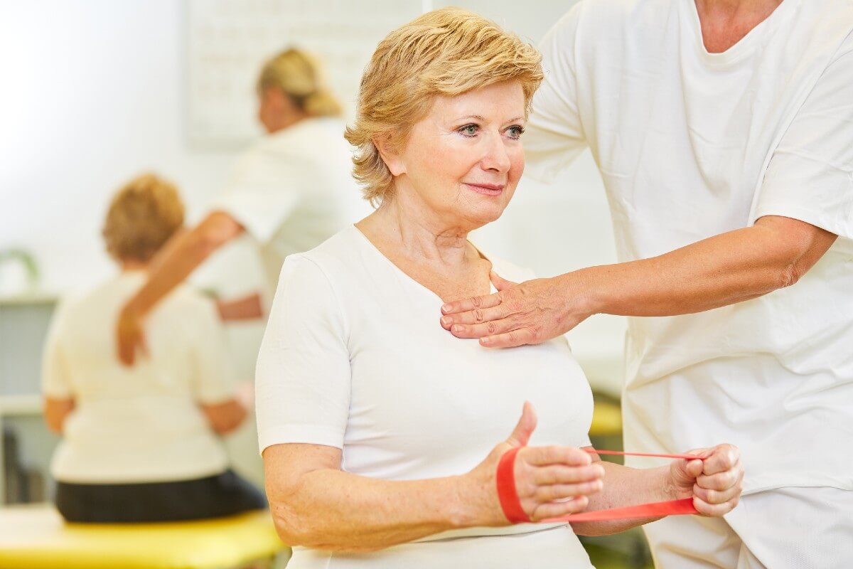 Elderly woman recieving rehabilitative care
